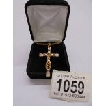 A superb quality yellow metal jewelled cross pendant on chain,