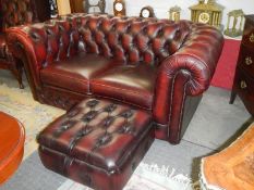 A two seat leather Chesterfield sofa with matching foot stool. COLLECT ONLY.