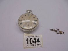 A silver pocket watch, D Bowen Alfreton, with key and in working order.