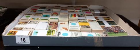 A box of card sets, tea cards etc