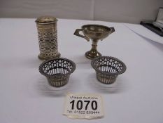 A silver pepper pot, a silver trophy and a pair of silver fretwork dishes.