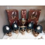 4 boxed gothic skull/police money boxes, 1 skull money box and a goblet