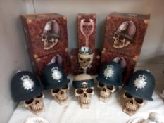 4 boxed gothic skull/police money boxes, 1 skull money box and a goblet