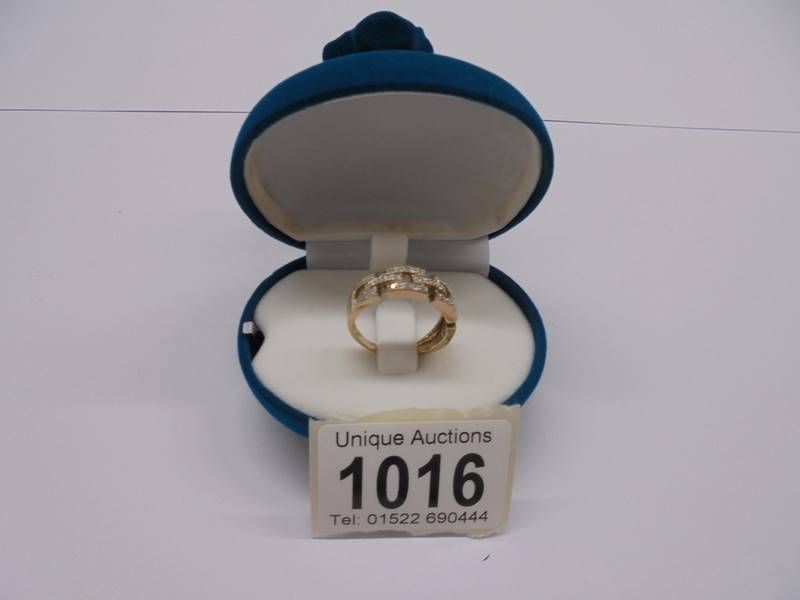 A yellow gold Greek Key style diamond ring, size P, 3.4 grams.
