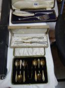 Three cased cutlery sets.