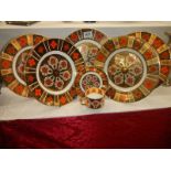 Five Burtondale Imari pattern plates and a cup and saucer.