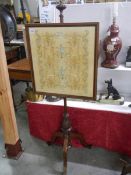 A Victorian mahogany pole screen with embroidered panel, COLLECT ONLY.