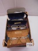 A quantity of circa 1940/50's reading glasses and other reading glasses.