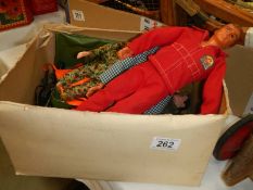 A box of vintage Action Man dolls, Six Million Dollar man and accessories.