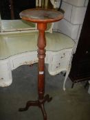 A mahogany torchere on tripod base, COLLECT ONLY.
