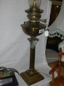 A brass Corinthian column oil lamp with chimney. COLLECT ONLY.