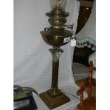 A brass Corinthian column oil lamp with chimney. COLLECT ONLY.