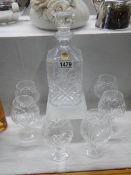 A cut glass decanter and six brandy goblets. COLLECT ONLY.