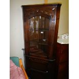 An oak glazed corner cabinet. COLLECT ONLY.