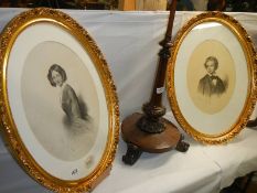 A pair of oval gilt framed and glazed signed portraits, COLLECT ONLY.