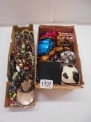 Two boxes of assorted necklaces and bracelets etc.,