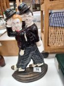 A cast metal Laurel and Hardy door stop