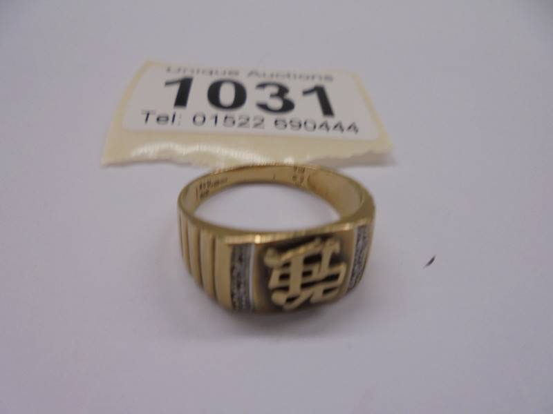 A 9ct gold ring with Chinese symbol, size Q, 3.7 grams.