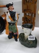 A Royal Doulton Cavalier figure and a Staffordshire Montgomery jug.