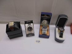 Four boxed Gent's wrist watches.