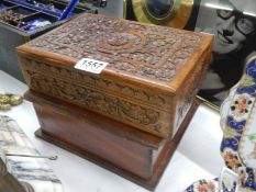 A carved wood box and one other.