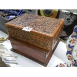 A carved wood box and one other.