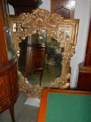 A heavy gilt framed mirror, COLLECT ONLY.