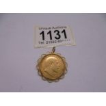 An Edward VII gold sovereign in a 9ct gold pendant mount.