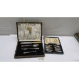 A cased child's feeding set and a cased set of four EPNS cake forks.