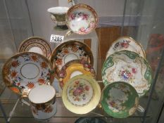 A good lot of hand painted tea cups and saucers.