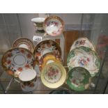 A good lot of hand painted tea cups and saucers.
