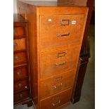 A four drawer wooden filing cabinet. COLLECT ONLY.