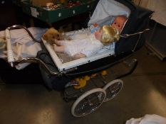 A Silver Cross dolls pram in good condition with two dolls and a teddy bear, COLLECT ONLY.