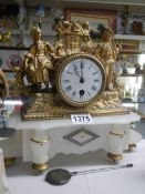 A French spelter clock on alabaster base, COLLECT ONLY.