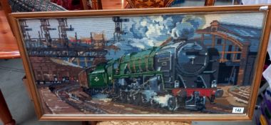 A framed and glazed tapestry of a steam engine 92220 Evening Star leaving Paddington COLLECT ONLY