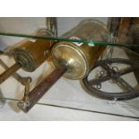 A large Victorian brass meat spit and one other.