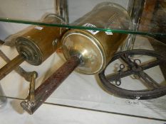 A large Victorian brass meat spit and one other.