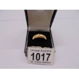 An 18ct gold ring with central diamonds, size W half, 9.62 grams,