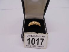 An 18ct gold ring with central diamonds, size W half, 9.62 grams,