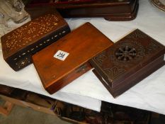 An inlaid wooden box and two others,