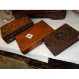 An inlaid wooden box and two others,