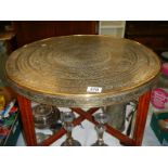A folding Indian brass topped table, COLLECT ONLY.