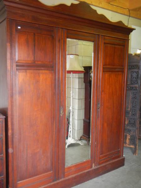 A fully fitted mahogany wardrobe with central mirrored door, COLLECT ONLY.