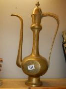 A tall Indian brass water jug.