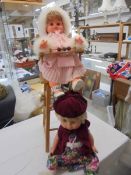 A dolls metamorphic high chair with two dolls. COLLECT ONLY.