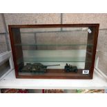 A model display cabinet with 2 plastic military models COLLECT ONLY