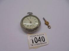 A silver pocket watch with key, marked Johannes Meyer, Soltan in working order.