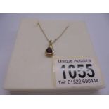 A 9ct gold pendant set red stone, marked 375. 1.5 grams.