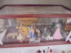A display case with doll house items. COLLECT ONLY.