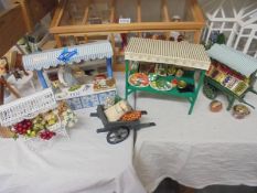 A quantity of doll house fishmonger and greengrocer market stands. COLLECT ONLY.